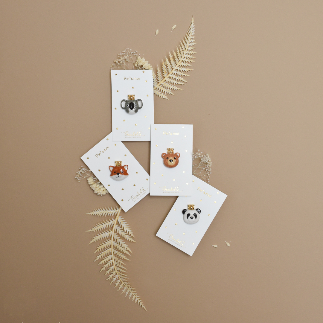 Photo de plusieurs pins ou broches de la collection animaux, de la marque Baubels.