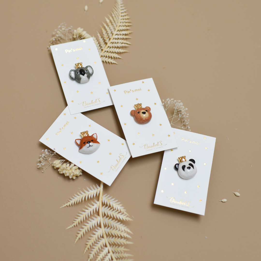 Photo de plusieurs pins ou broches de la collection animaux, de la marque Baubels.